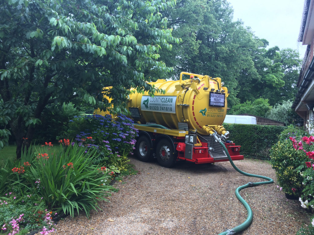 A Vacuum tanker emptying a domestic septic tank